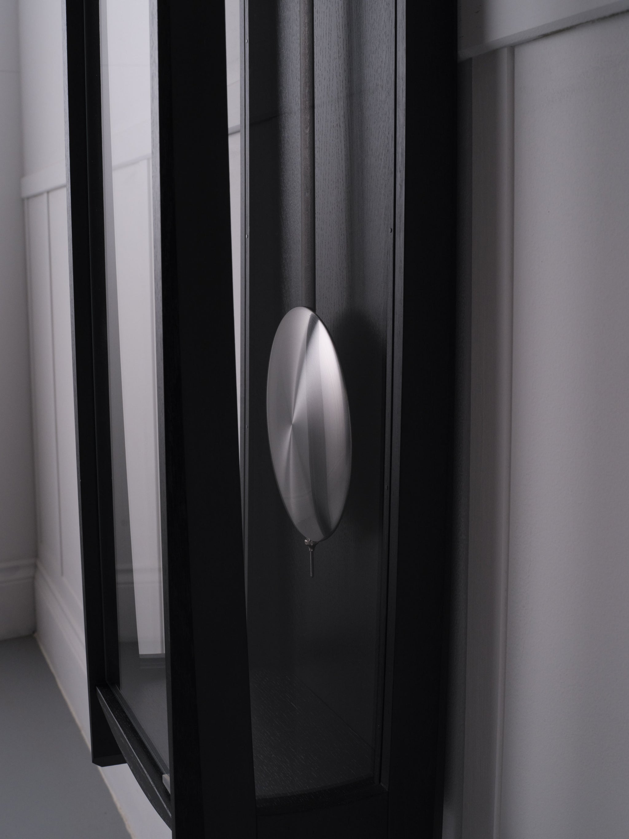 Close up of the pendulum on The Froxfield Wall Regulator.