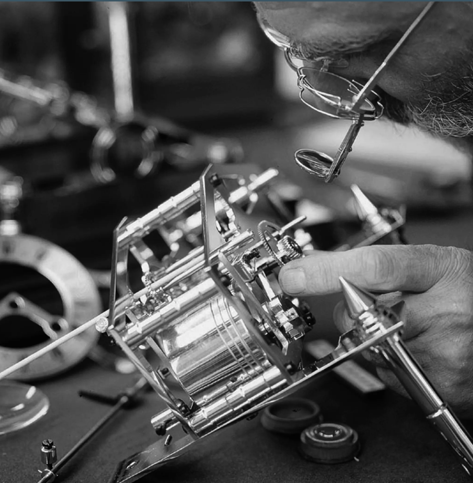 Clockmaker adjusting movement